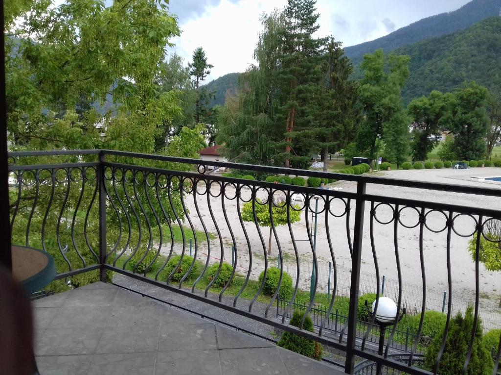 a balcony with a wrought iron fence and a road at Apartment Nice View in Fojnica