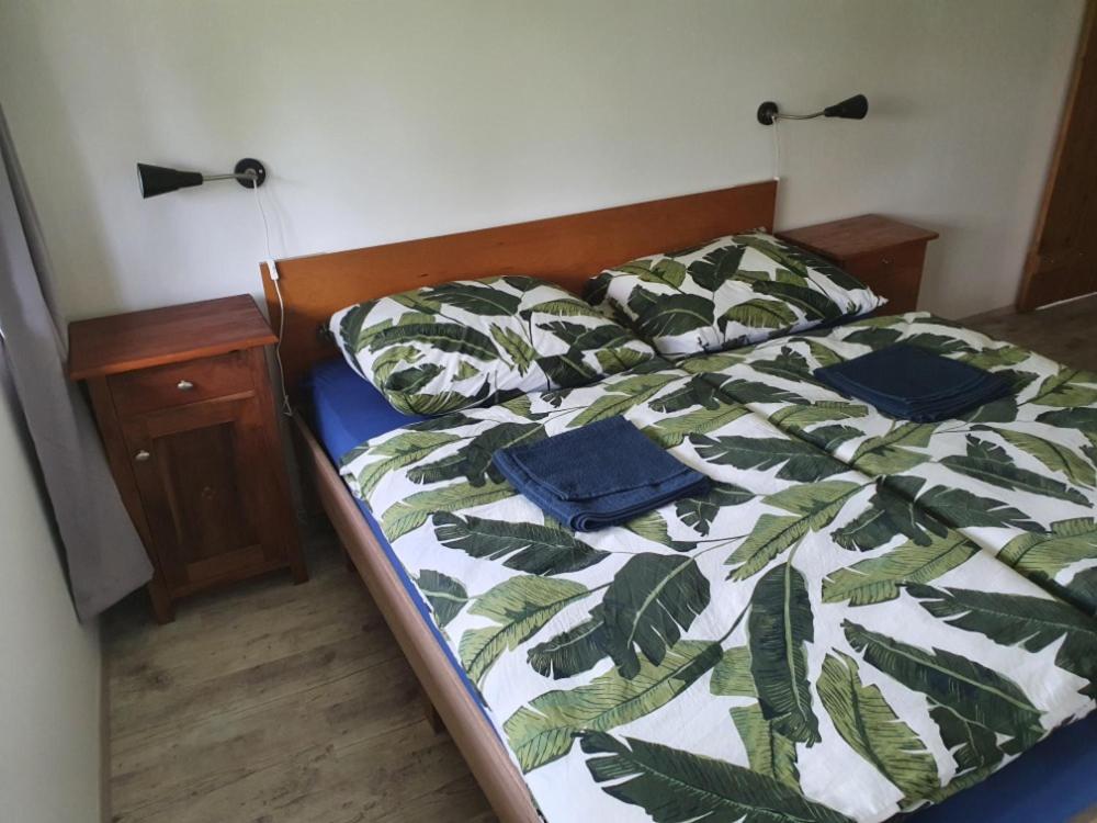 Postel nebo postele na pokoji v ubytování Apartmány Svatá