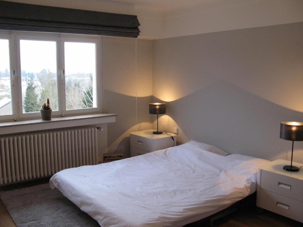 Rúm í herbergi á Residence Key Inn - Limperstberg