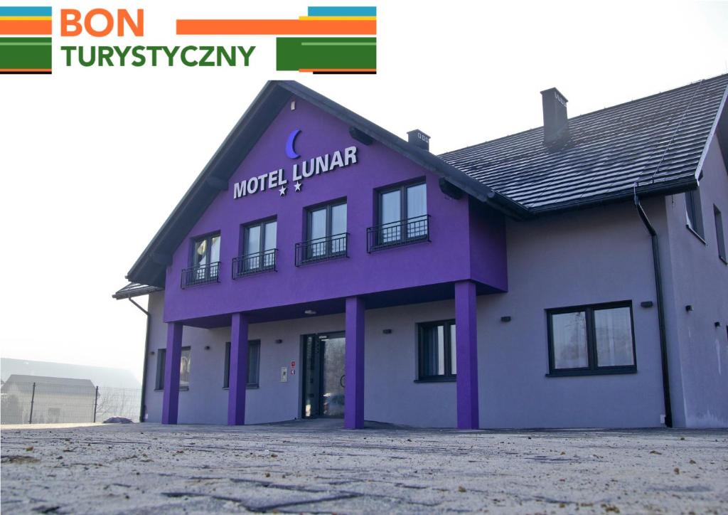 a purple building with the words motel lurer on it at Motel Lunar in Oświęcim