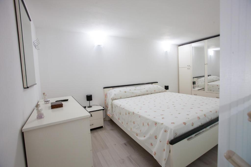 Łóżko lub łóżka w pokoju w obiekcie Casa Terranova Modica
