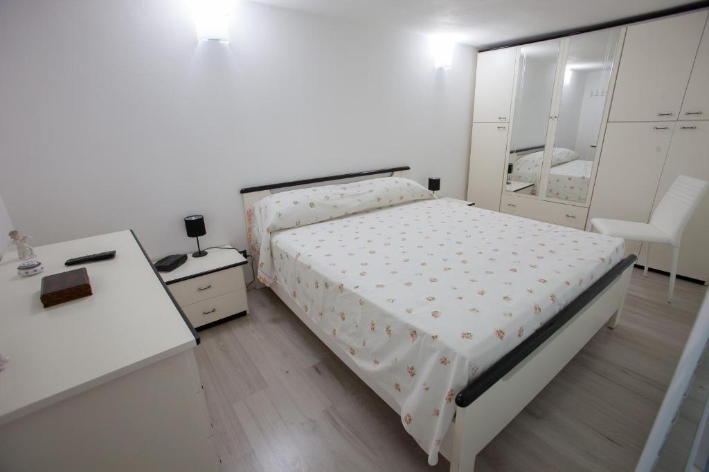Łóżko lub łóżka w pokoju w obiekcie Casa Terranova Modica