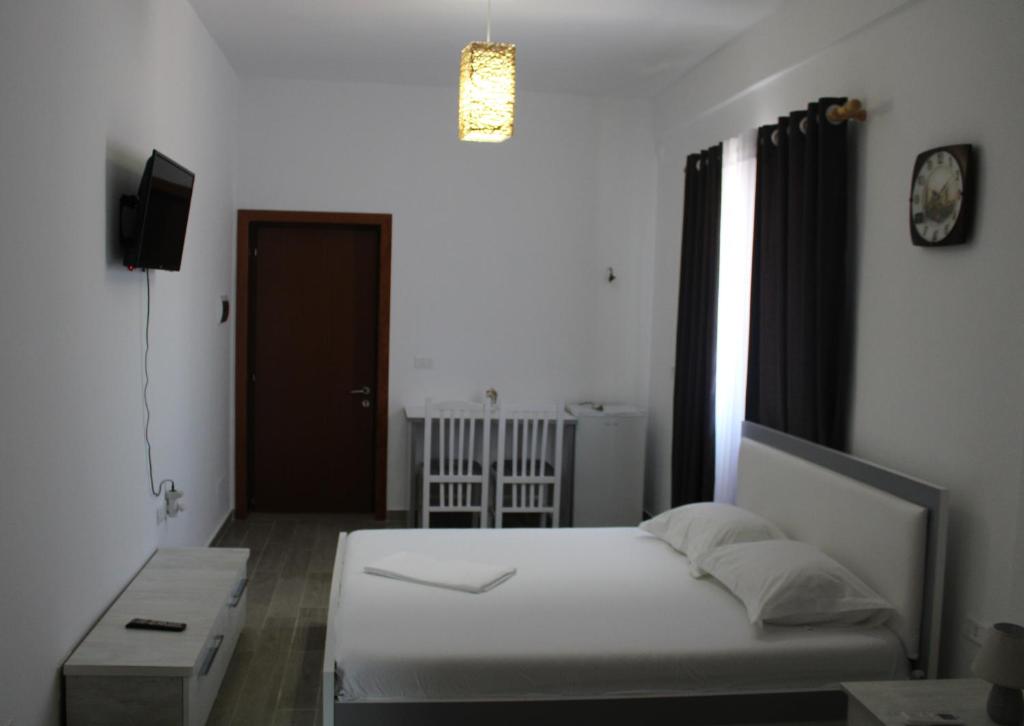 Postel nebo postele na pokoji v ubytování HC Hotel & Suites