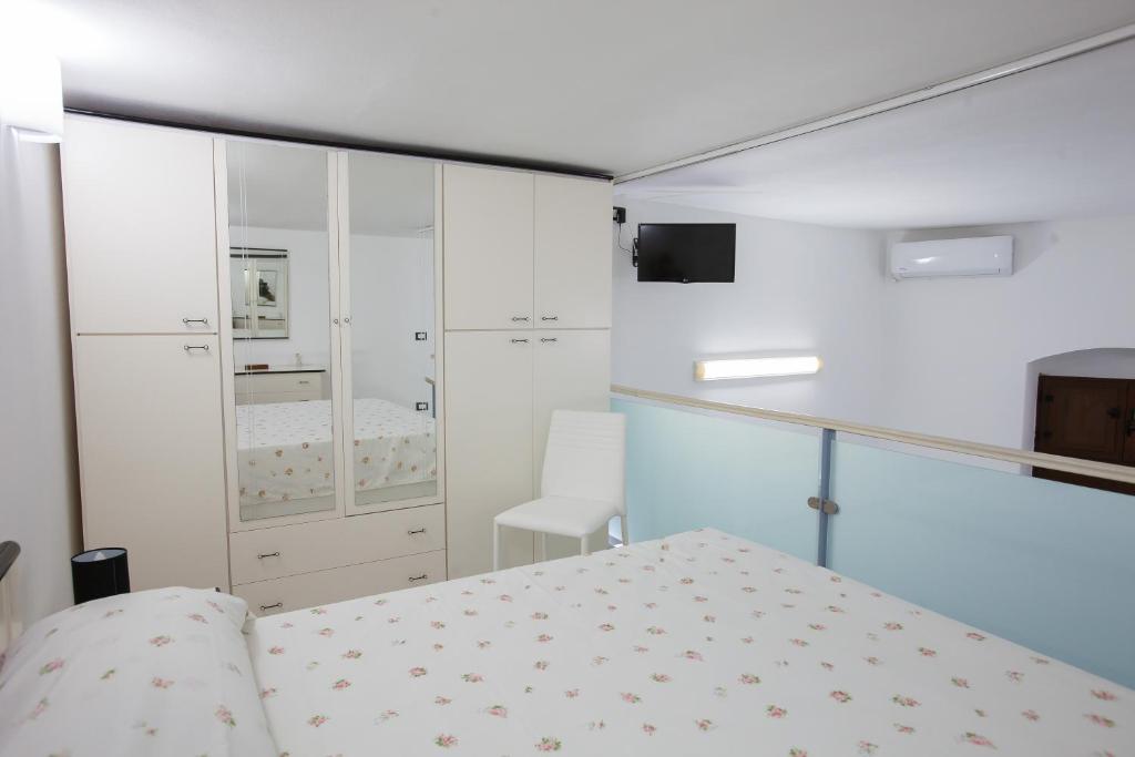Łóżko lub łóżka w pokoju w obiekcie Casa Terranova Modica