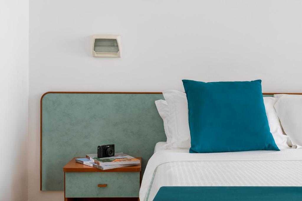Postel nebo postele na pokoji v ubytování Hotel Très Jolie