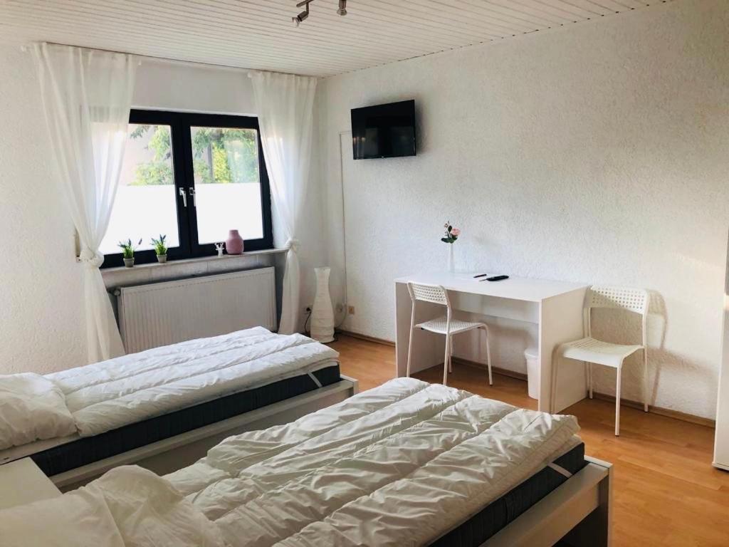 Postel nebo postele na pokoji v ubytování Pension Platzhirsch