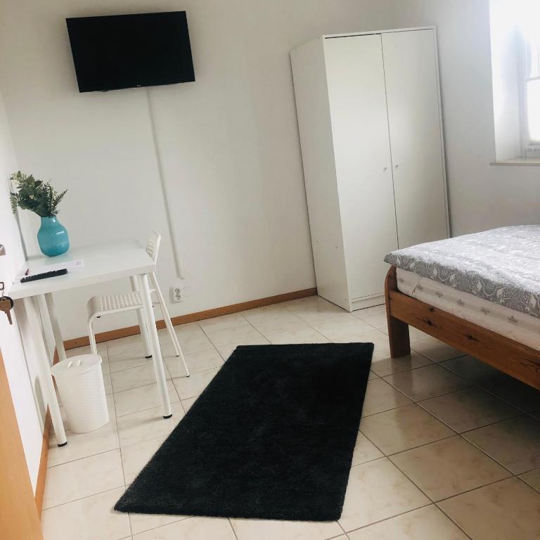 Postel nebo postele na pokoji v ubytování Pension Platzhirsch