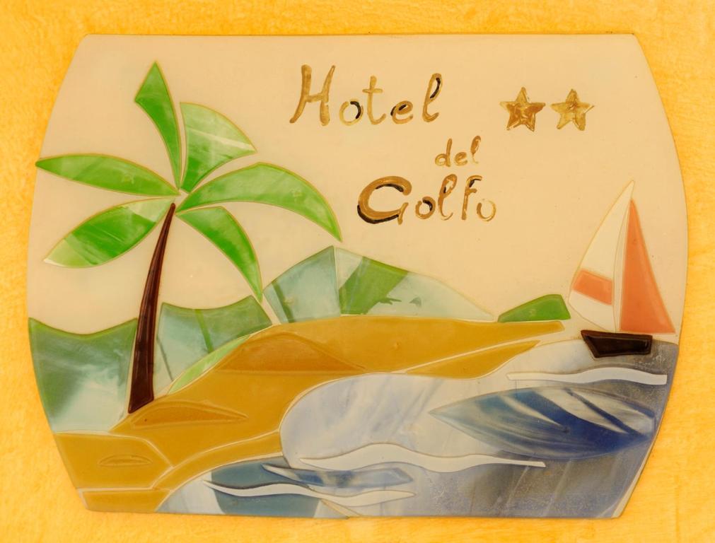 a birthday cake with a palm tree and a boat at Hotel Del Golfo in Laigueglia