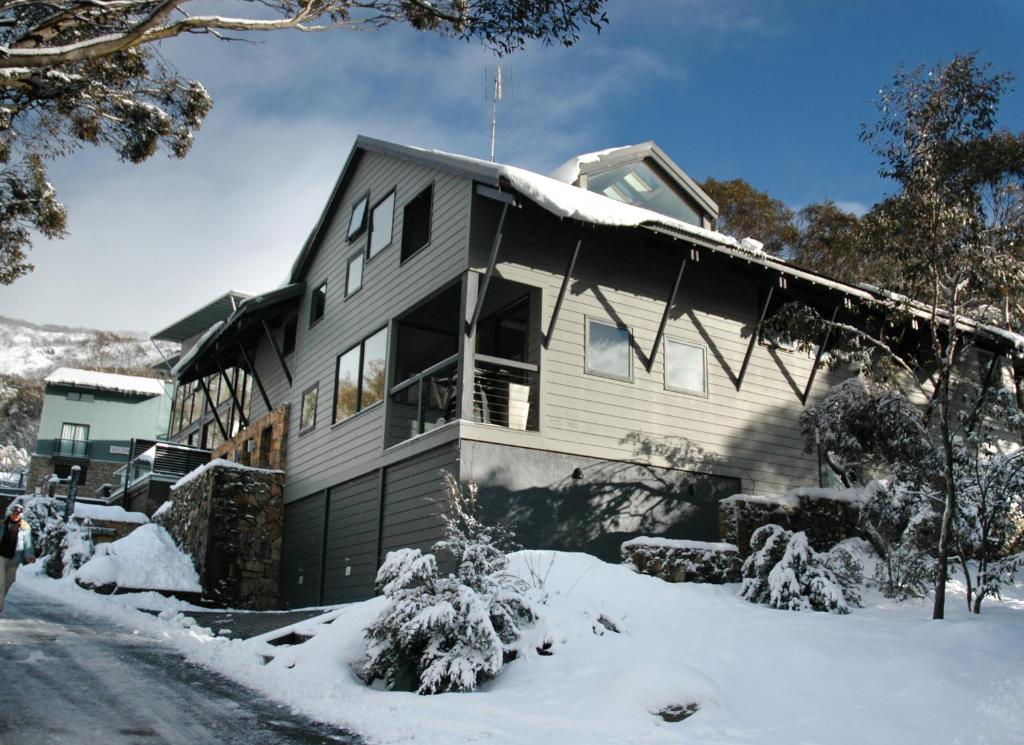 a house is covered in snow with snow at Ramshead Creek 3 in Thredbo
