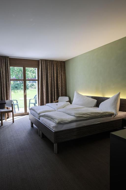 Postel nebo postele na pokoji v ubytování Hotel Restaurant Seegarten
