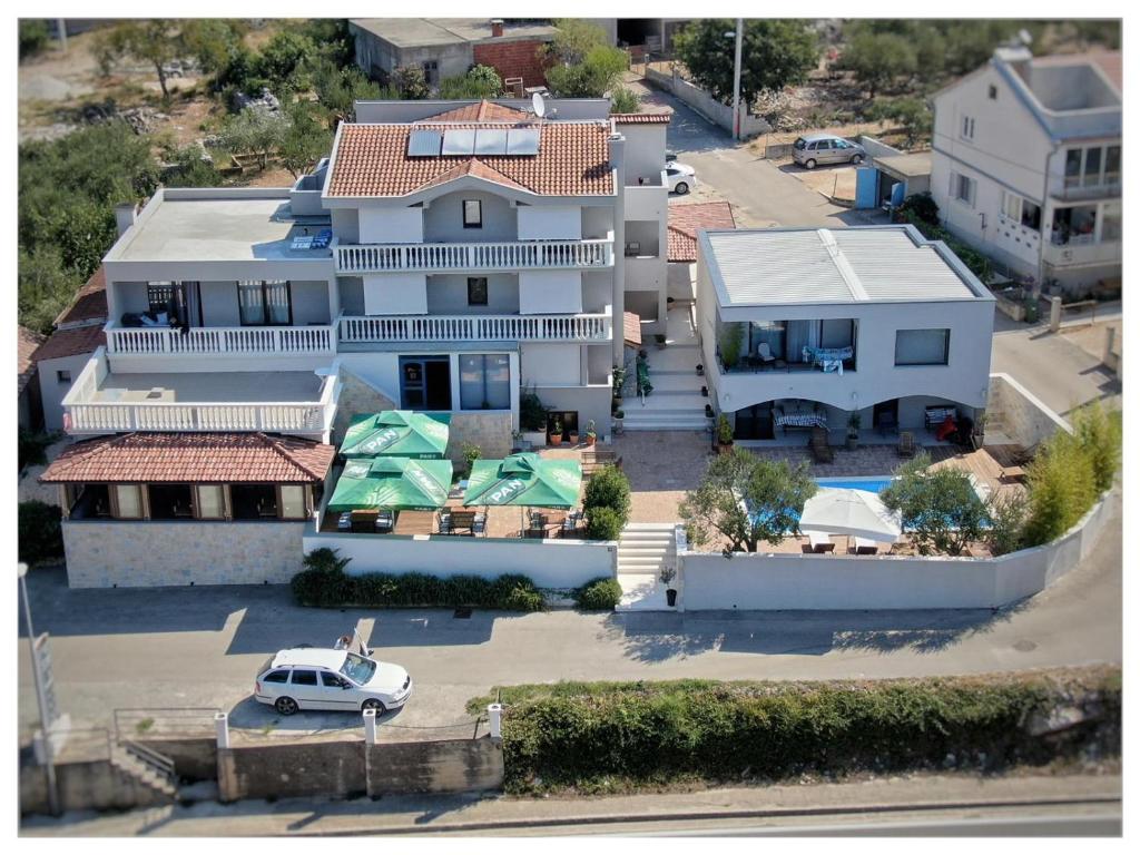 an aerial view of a house with a car in a parking lot at Hotel Stipe in Drage