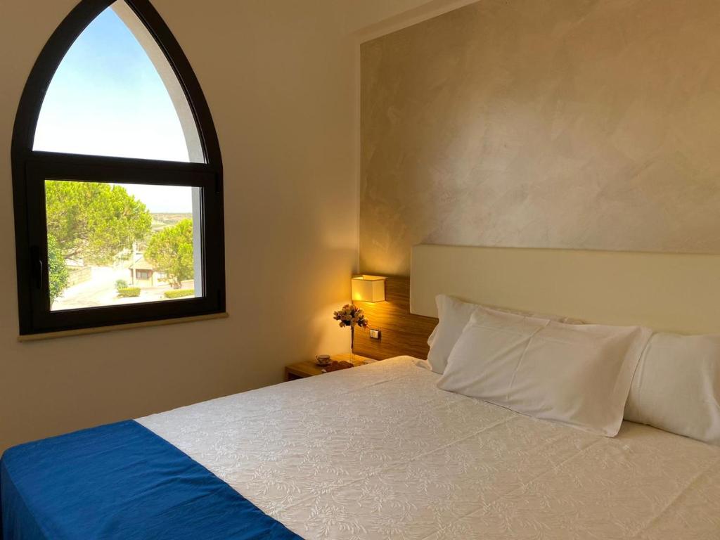 Postel nebo postele na pokoji v ubytování La Rustica Hotel