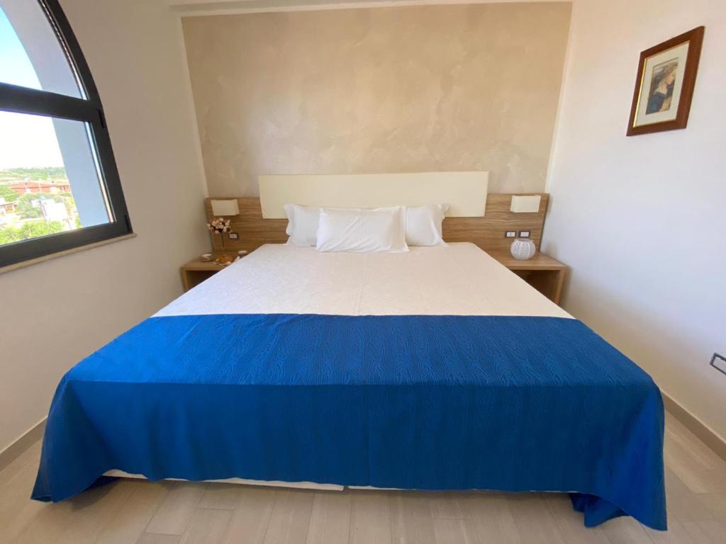 Postel nebo postele na pokoji v ubytování La Rustica Hotel