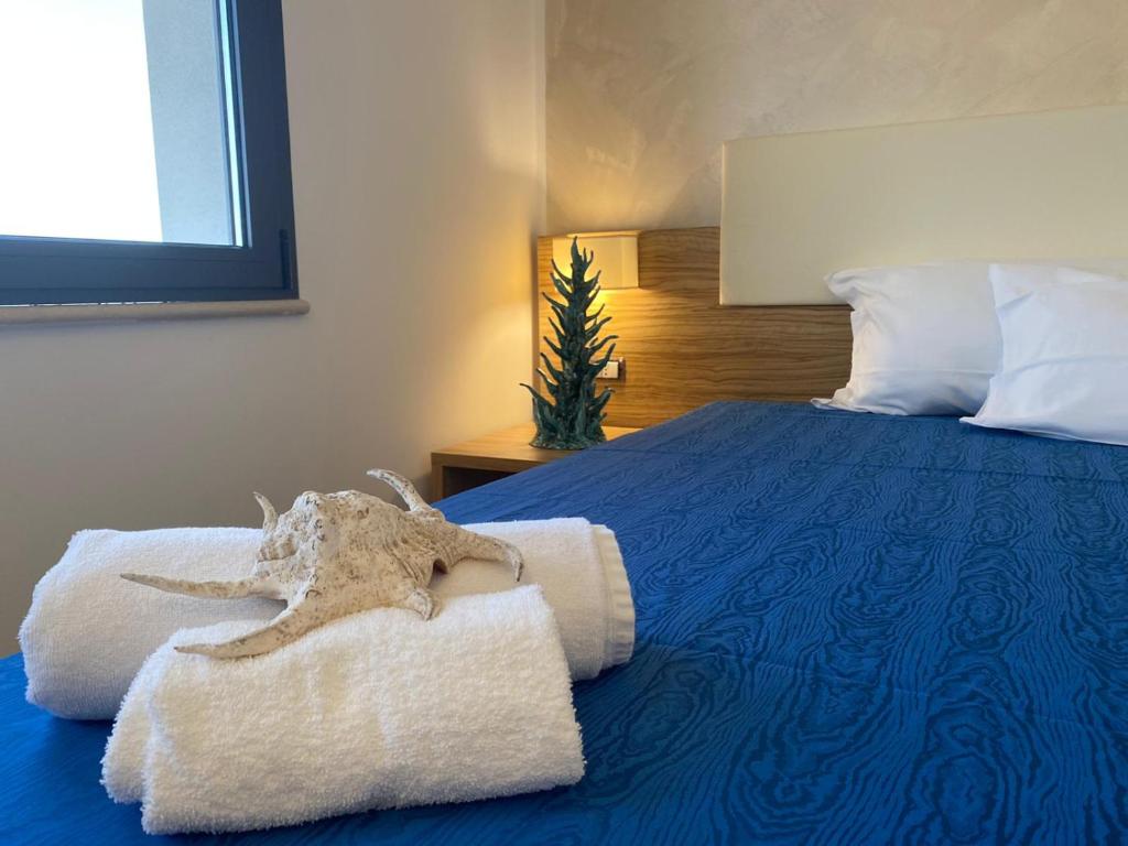Postel nebo postele na pokoji v ubytování La Rustica Hotel