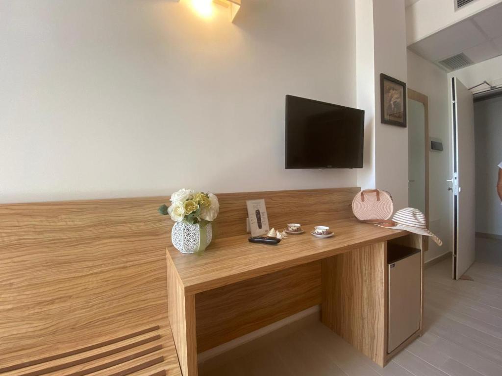 TV a/nebo společenská místnost v ubytování La Rustica Hotel