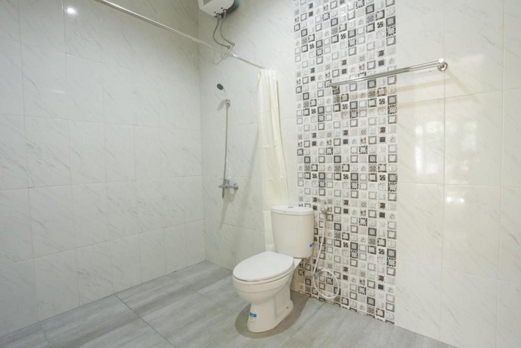 Koupelna v ubytování IDR Green Guest House Syariah Mitra RedDoorz