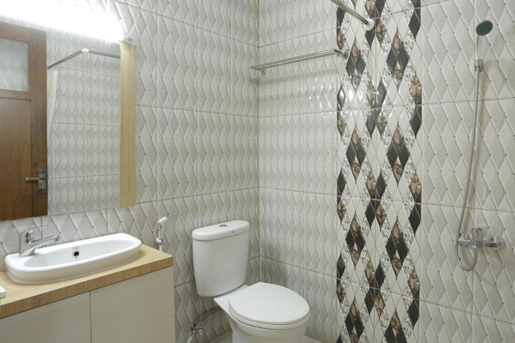 Koupelna v ubytování IDR Green Guest House Syariah Mitra RedDoorz
