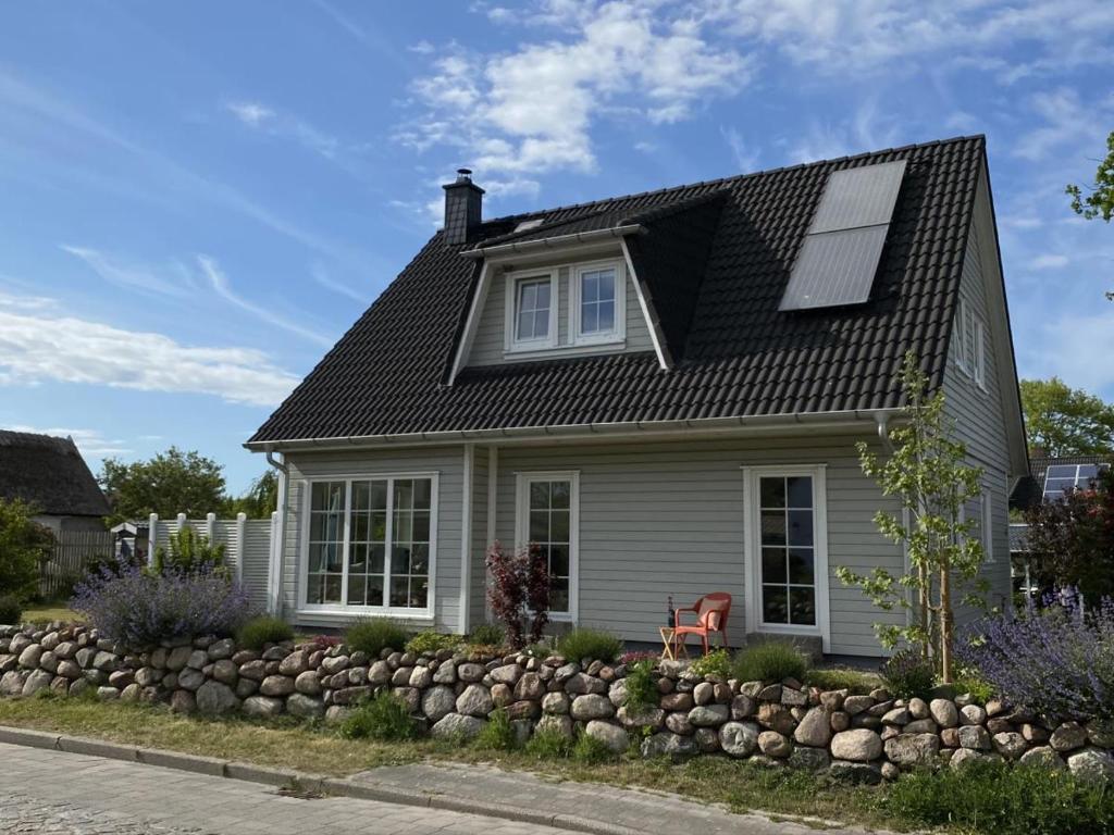 a house with a solar panel on the roof at Hus Hygge in Born