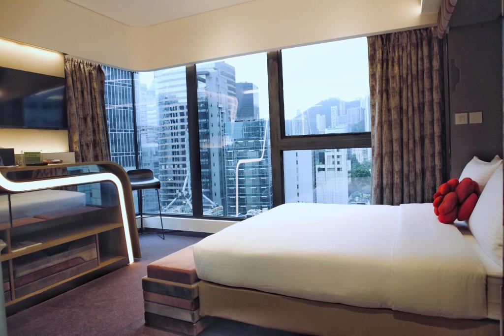 Letto o letti in una camera di Butterfly on LKF, Central