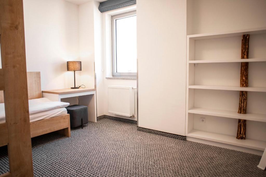 Postel nebo postele na pokoji v ubytování Apartmány Koflík