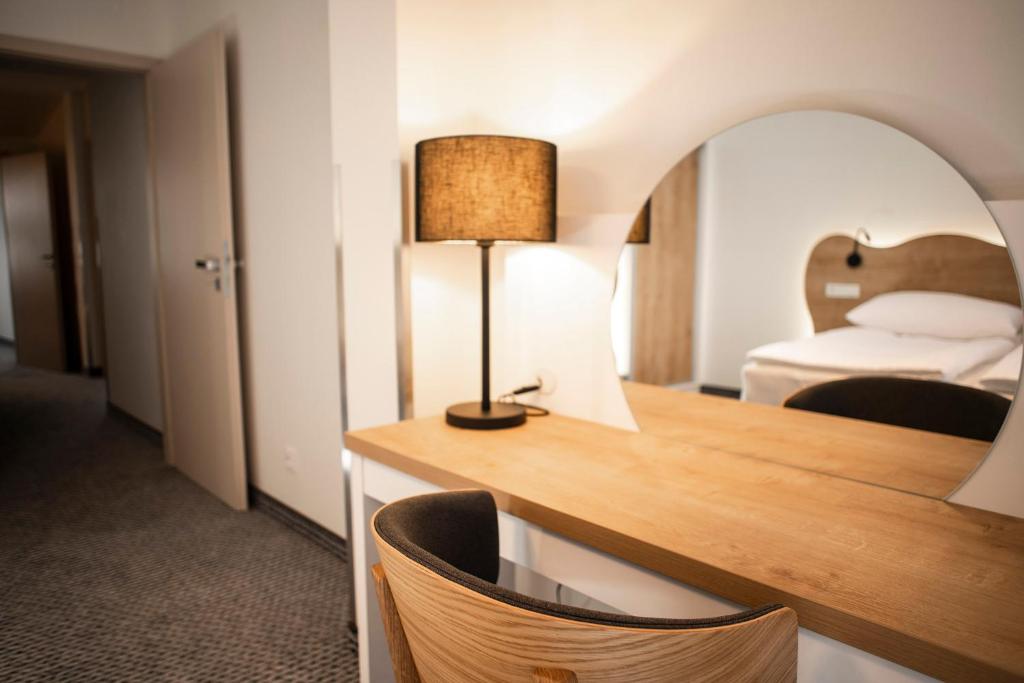 Postel nebo postele na pokoji v ubytování Apartmány Koflík