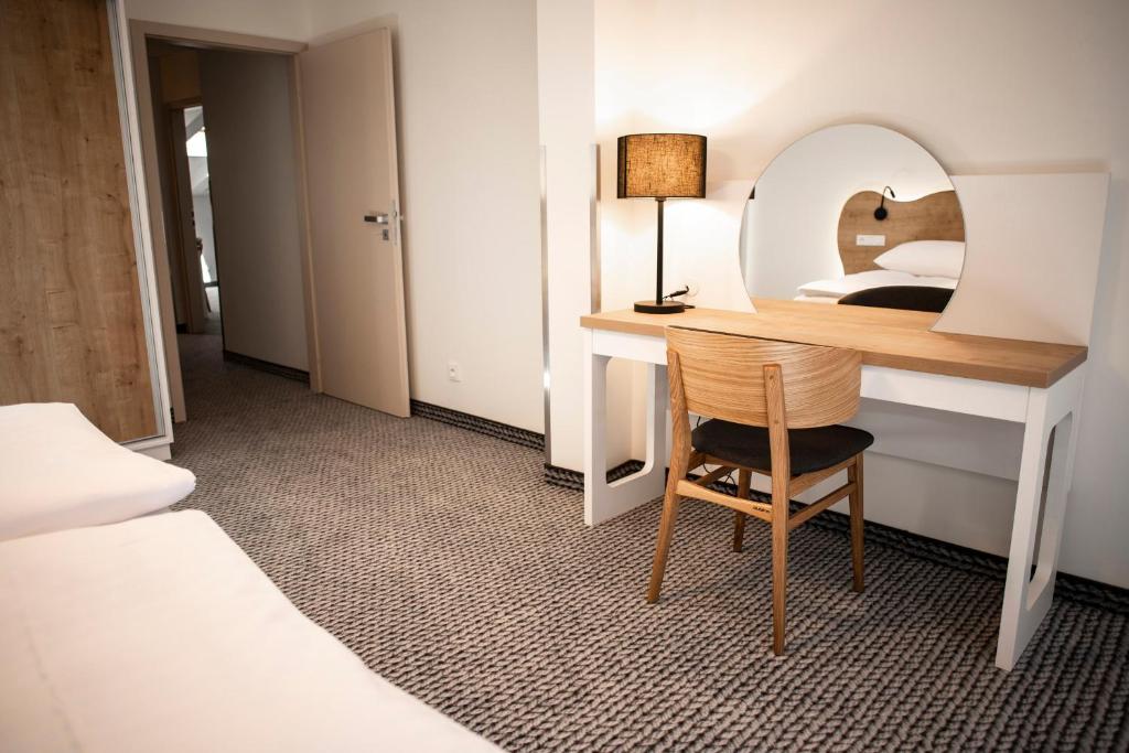 Postel nebo postele na pokoji v ubytování Apartmány Koflík