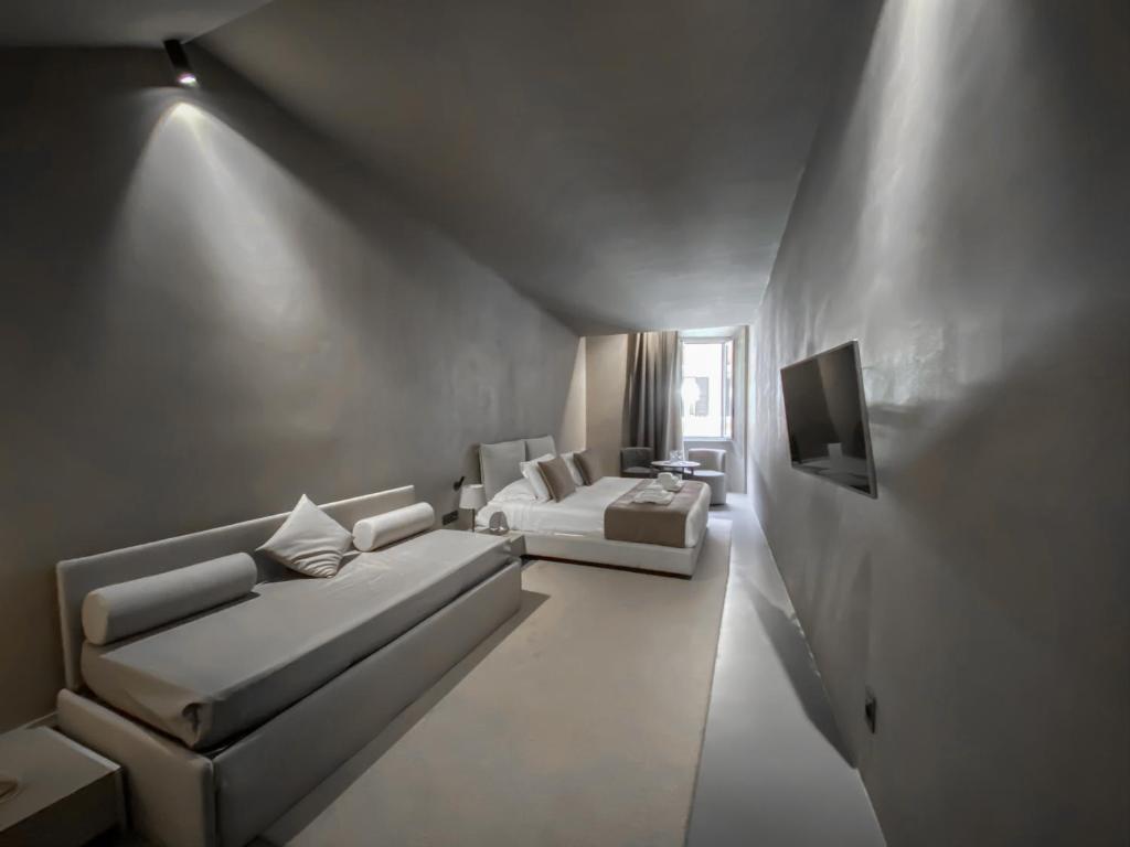 Posteľ alebo postele v izbe v ubytovaní Elysium Suites collection