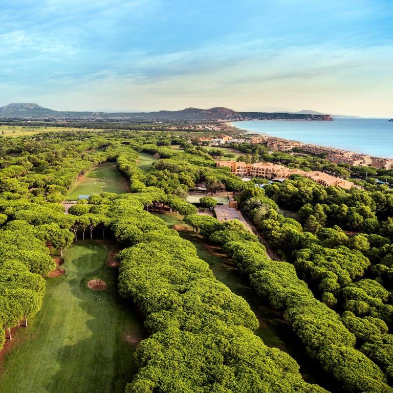 an aerial view of a river with trees at La Costa Hotel Golf & Beach Resort in Pals