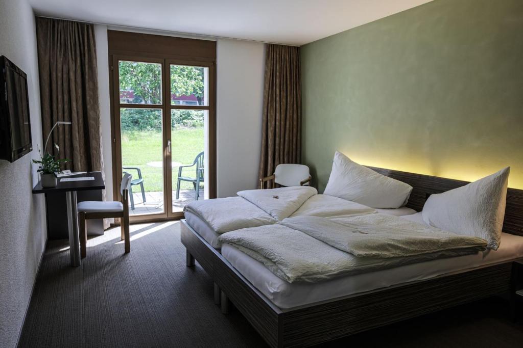 Postel nebo postele na pokoji v ubytování Hotel Restaurant Seegarten