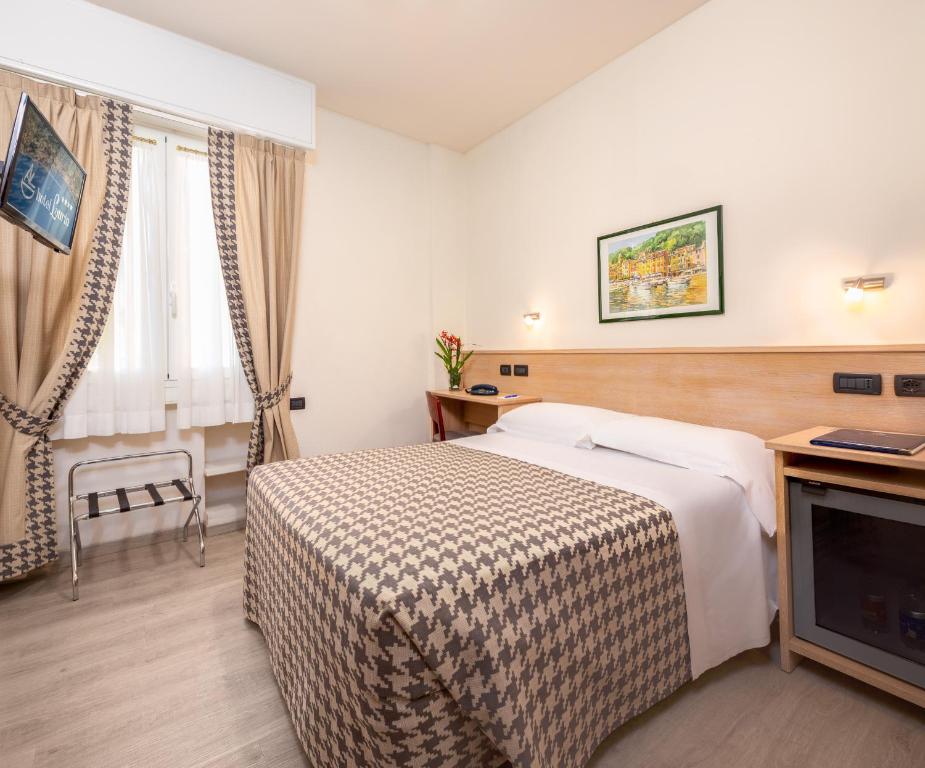 TV a/nebo společenská místnost v ubytování Hotel Laurin