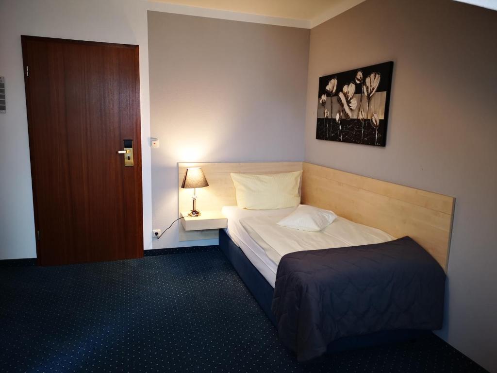 Postel nebo postele na pokoji v ubytování Hotel Restaurant Molitor