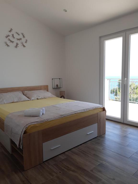 Posteľ alebo postele v izbe v ubytovaní Sea view Apartment