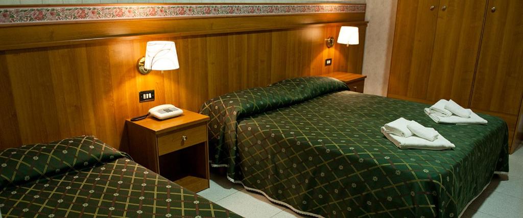 Postel nebo postele na pokoji v ubytování Hotel Capys