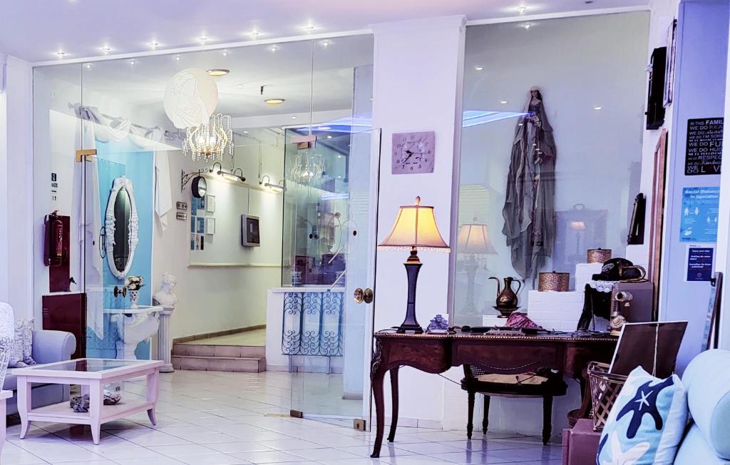 a shop with a table and a lamp in a room at Thalia deco City & Beach Hotel in Hersonissos