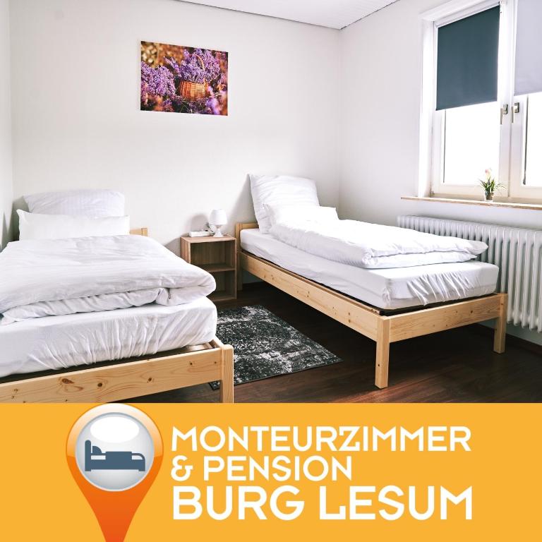 two twin beds in a bedroom with avertisement for at Pension & Monteurwohnungen Burglesum Bremen in Bremen