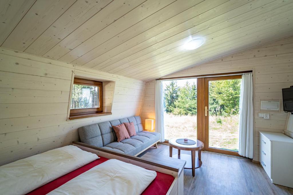 Postel nebo postele na pokoji v ubytování Apartmány Chata Jedlová hora