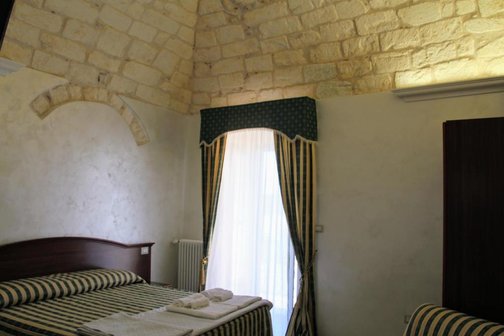 Postel nebo postele na pokoji v ubytování Rooms Dimora Arco - Affitti Brevi Italia