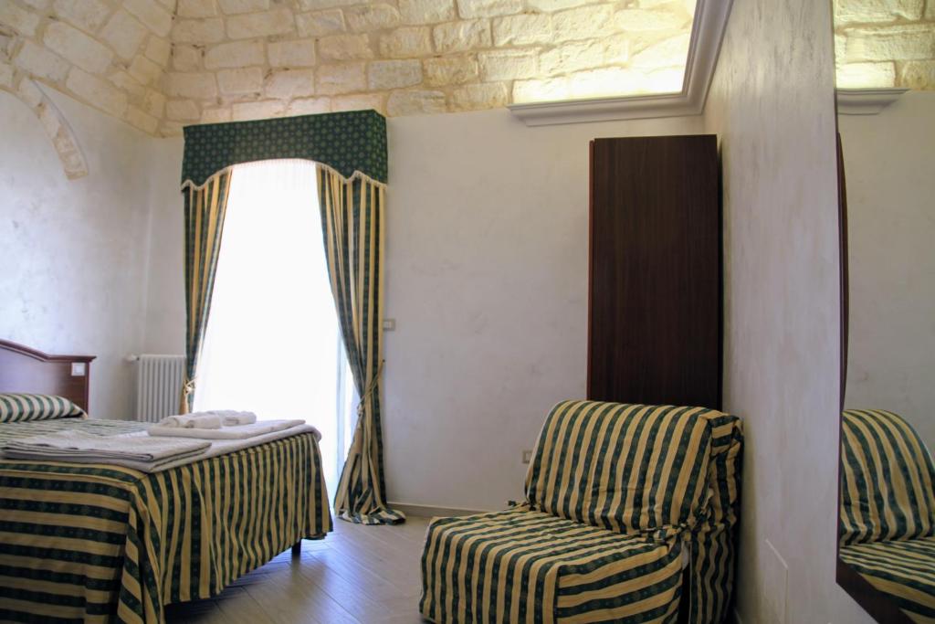 Postel nebo postele na pokoji v ubytování Rooms Dimora Arco - Affitti Brevi Italia
