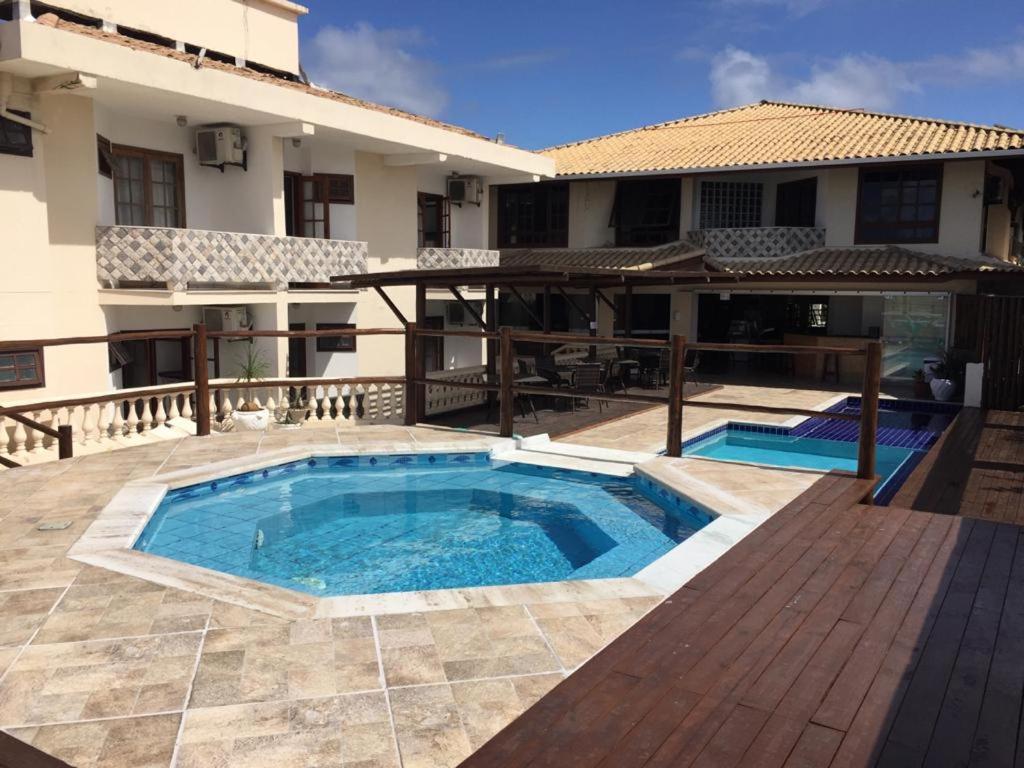 Bazén v ubytování Eden Praia Hotel nebo v jeho okolí