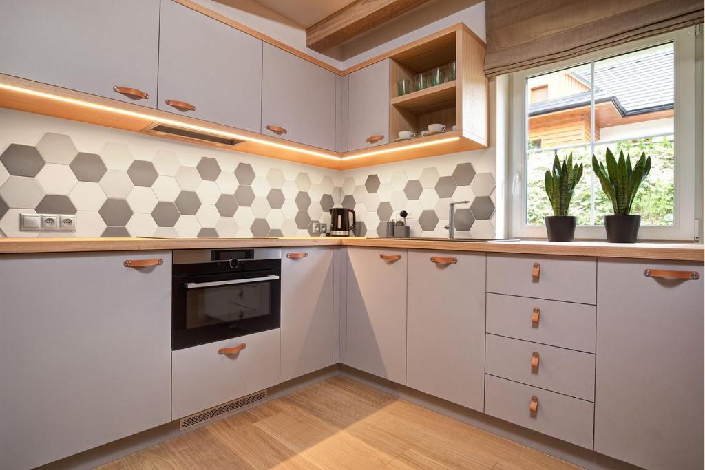 Kuchyň nebo kuchyňský kout v ubytování VRÁTNA Apartmány Stoh A1 a C1