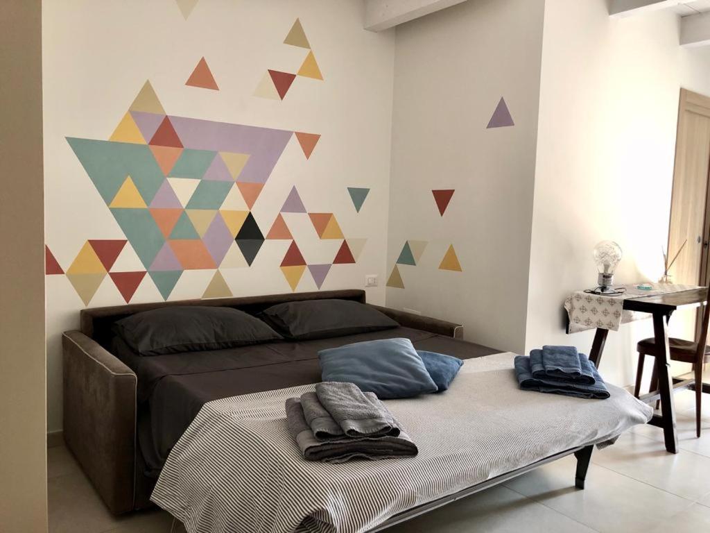 Postel nebo postele na pokoji v ubytování B&B Al Gravattone