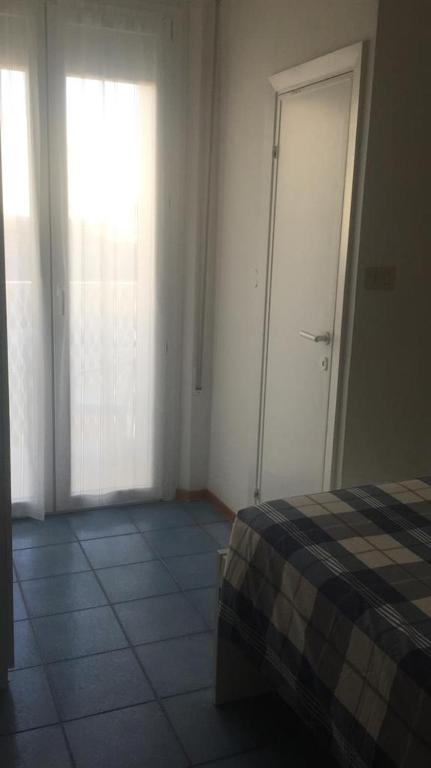 Postel nebo postele na pokoji v ubytování Hotel Spiaggia