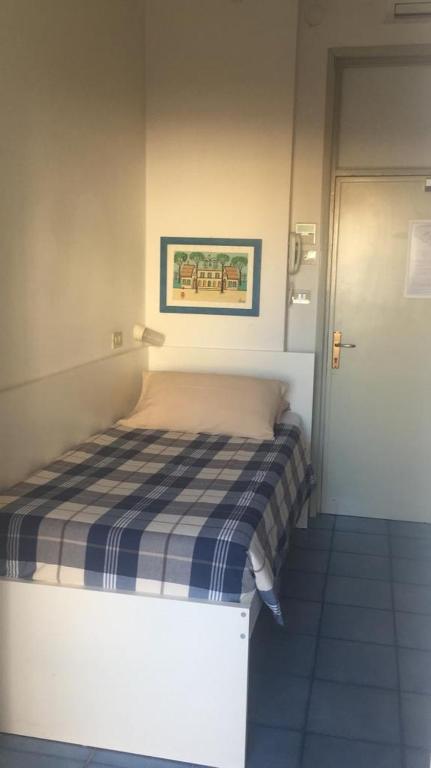 Postel nebo postele na pokoji v ubytování Hotel Spiaggia