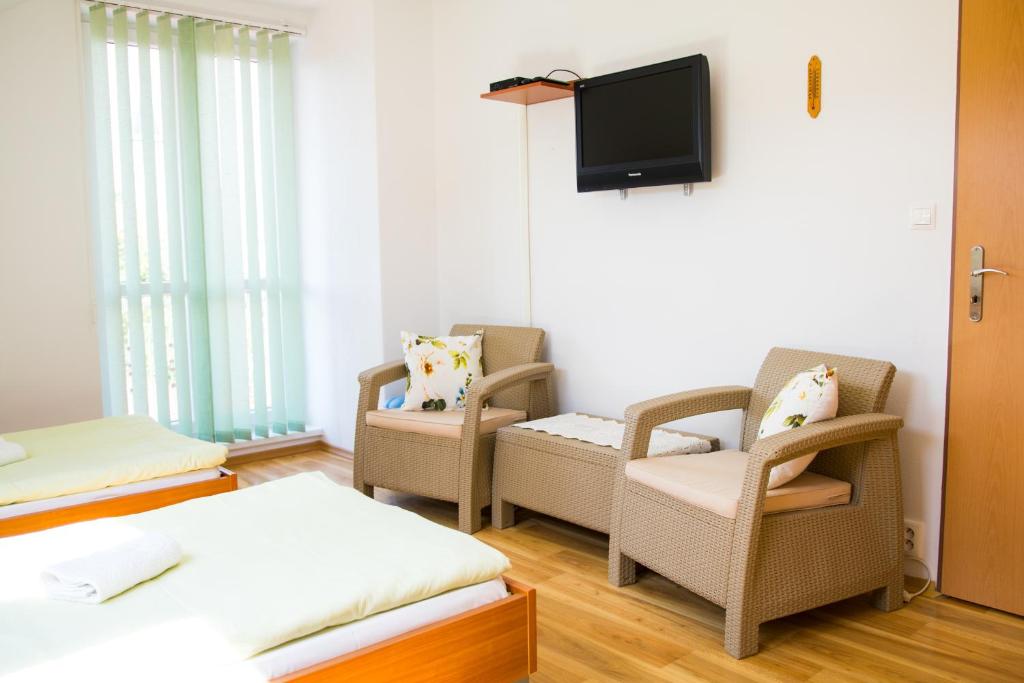 Postel nebo postele na pokoji v ubytování Vila Adria