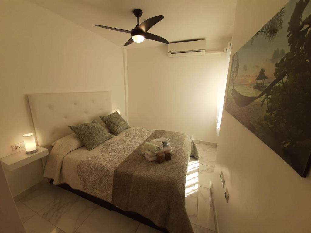 Postel nebo postele na pokoji v ubytování Appartement avec Solarium
