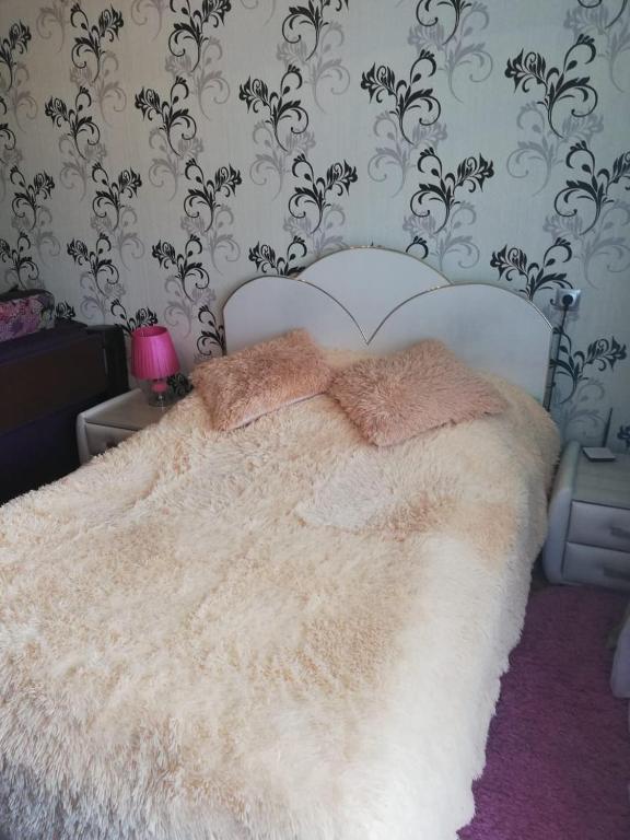 
Кровать или кровати в номере Apartment 2-ya Yuzhnaya
