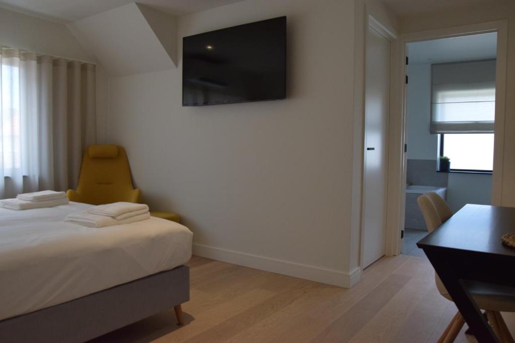 TV a/nebo společenská místnost v ubytování B&B Villa Mimosa