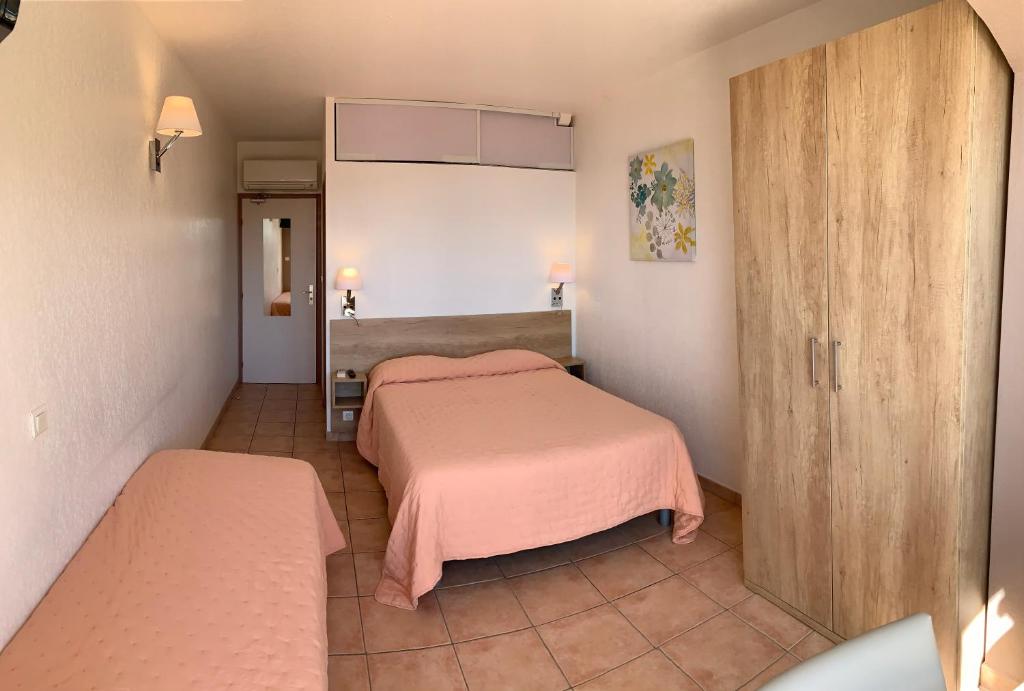 Postel nebo postele na pokoji v ubytování Hotel Alata