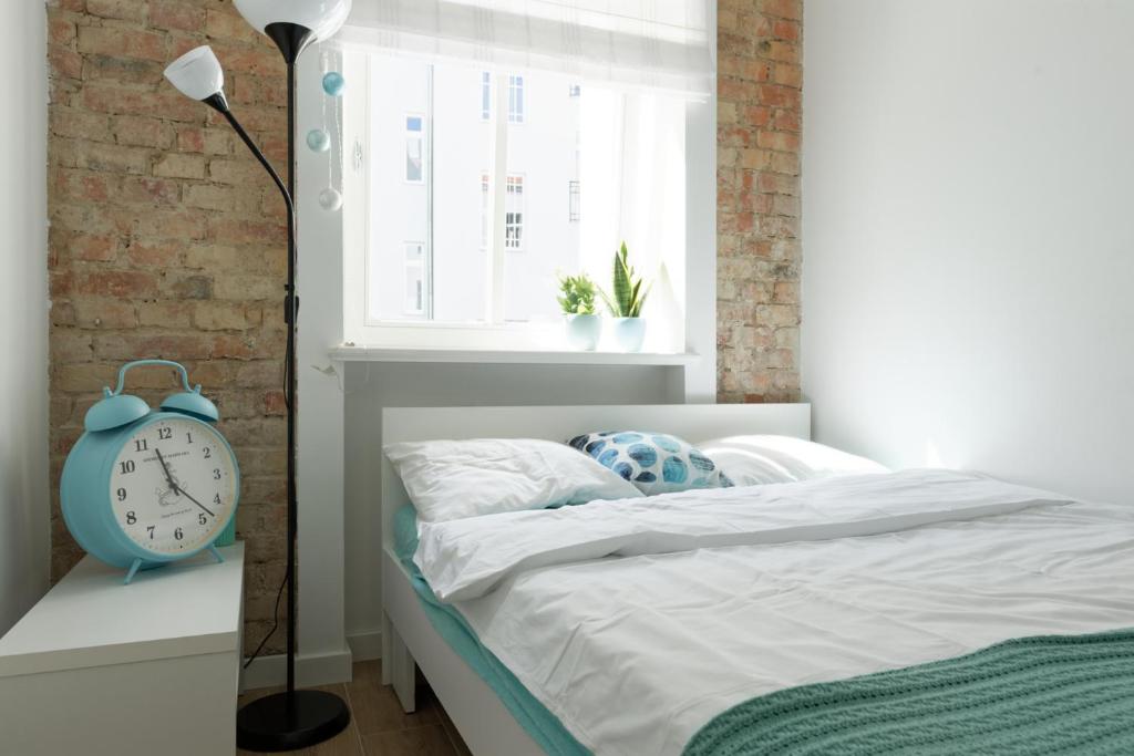 Posteľ alebo postele v izbe v ubytovaní Apartament Wilda Nova