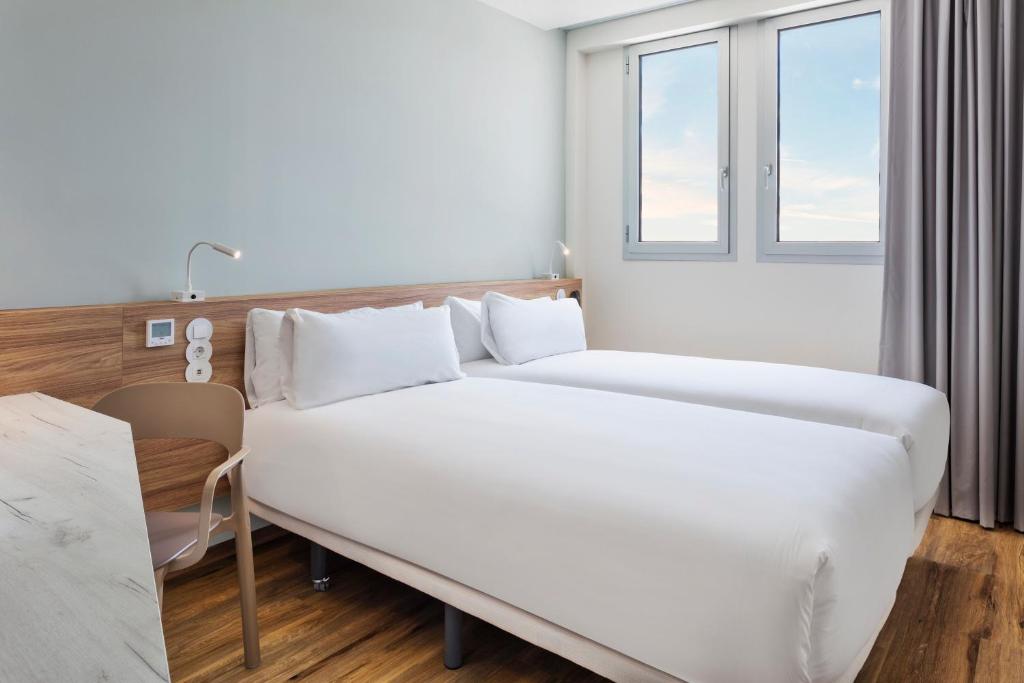Postel nebo postele na pokoji v ubytování B&B HOTEL Lisboa Aeroporto